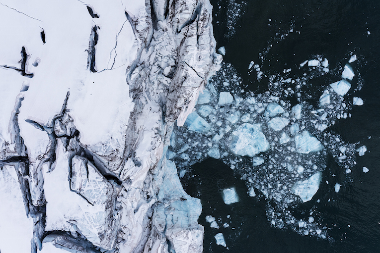 Calved ice from a glacier at Scoresby Sund fjord, east coast of Greenland.