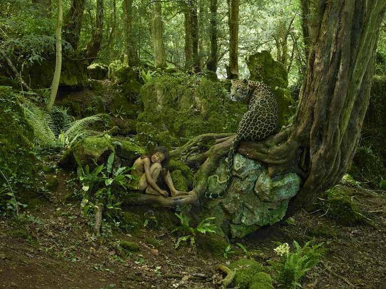 A feral child is one which has lived isolated from human contact, often from a very young age. As a result the child grows up with little or no experience of human care, behaviour or language. Some were cruelly confined or abandoned by their own parents, rejected perhaps because of their intellectual or physical impairment, or the parent's belief that this was the case. In other instances the loss of both parents was the cause. Others ran away after experiencing abuse. Yet more ended up in the wild and were "adopted" by animals as a result of a wide variety of circumstances  getting lost, being taken by wild animals, etc. Documented cases of feral children are geographically spread over four continents, and vary in age from babies taken by wild animals up to eight year olds. Of course, these cases are only known of because the child survived. It is not difficult to think that there are probably untold cases where the outcome was less favourable.As a mother of two young boys I was appalled and intrigued in turn when I first learned about feral children. My initial reaction was to think how parents could either neglect or lose their child. My maternal instinct goes into overdrive when I consider these young people experiencing their lives alone or in the company of wild animals. Then I consider and admire the fortitude they must have shown to survive such isolation and extreme circumstances. In any of the circumstances that I have read about, it completely overwhelms the boundaries of my comprehension. However, I have risen to the challenge of trying to capture my thoughts photographically about the isolation under which these youngsters found themselves, wondering at the same time if those living in the companionship of wild animals were perhaps better off than those whose young lives were spent with no companionship at all. I chose 15 cases to portray, these range from a girl who as a toddler was confined by her parents to a potty chair for ten years to that of a baby boy who was stolen by a leopardess and found three years later in the company of her and her latest cubs. My idea was not to replicate the exact scenes, but to interpret and duplicate the feelings and actions of each feral child living their experience. Some spent most of their time indoors, even in close proximity to or inside human habitation. Yet others spent the duration of their feral life outside, exposed to the elements, depending on their own ability and that of their wild companions for shelter and food and water, not to mention constantly having to avoid danger and health problems. Life is complex, for some more than others, even when we are considering a normal human life. Its complexity varies from one part of the globe to the other. In considering feral children, who are fully human, at least at the start of their lives, how can we not look at my images and question and wonder about the tenacious survival instincts of these 15 human beings.
