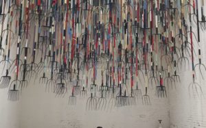 Visitors Bravely Stand Under 300 Sharp Pitchforks Suspended From the Ceiling
